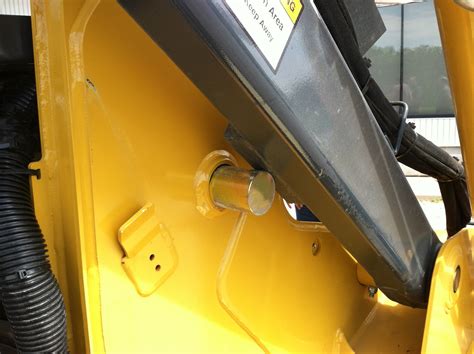 john deere skid steer lock a|skidsteer jd 250 boom lock.